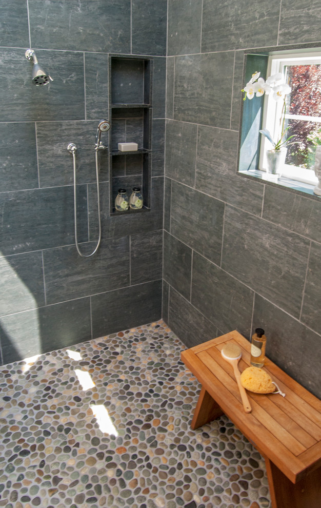 This is an example of a large modern ensuite bathroom in Philadelphia with a walk-in shower, black tiles, porcelain tiles, pebble tile flooring and beige walls.