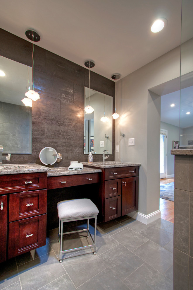 Large elegant master gray tile and ceramic tile ceramic tile walk-in shower photo in St Louis with shaker cabinets, brown cabinets, a two-piece toilet, gray walls, an undermount sink and granite countertops