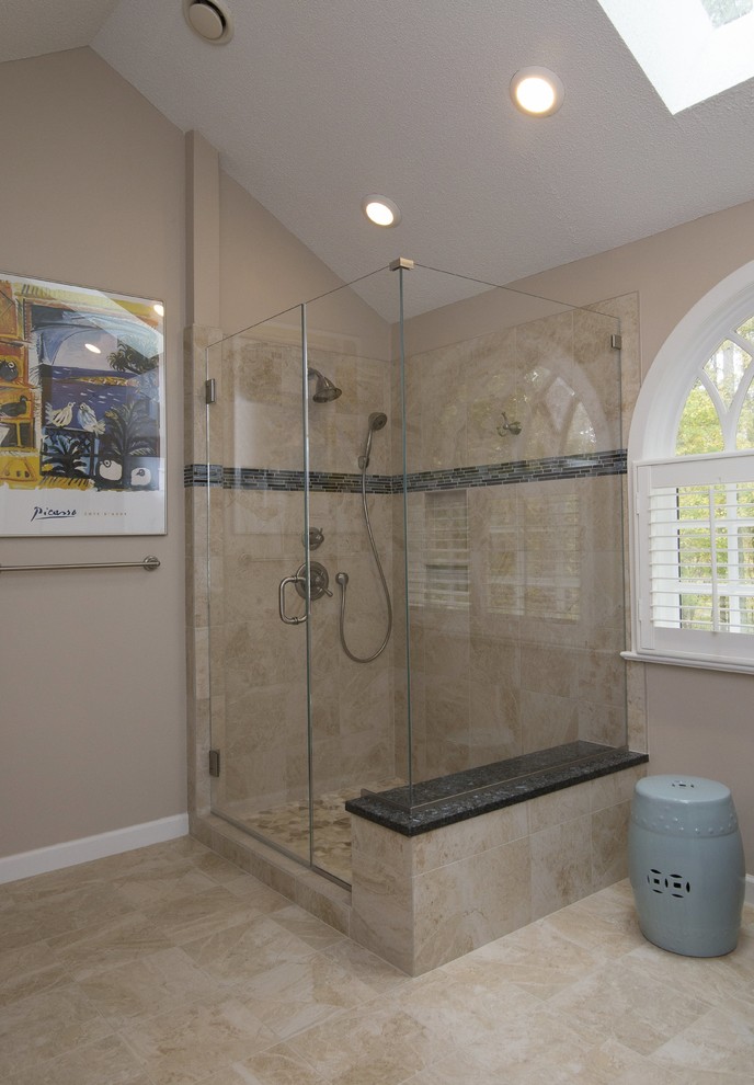 Large transitional master beige tile and porcelain tile porcelain tile and beige floor corner shower photo in Raleigh with raised-panel cabinets, dark wood cabinets, a two-piece toilet, beige walls, an undermount sink, granite countertops, a hinged shower door and blue countertops