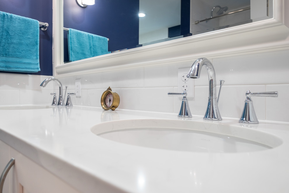 Example of a mid-sized classic master white tile and ceramic tile porcelain tile bathroom design in Portland with recessed-panel cabinets, white cabinets, a two-piece toilet, blue walls, an undermount sink and quartz countertops
