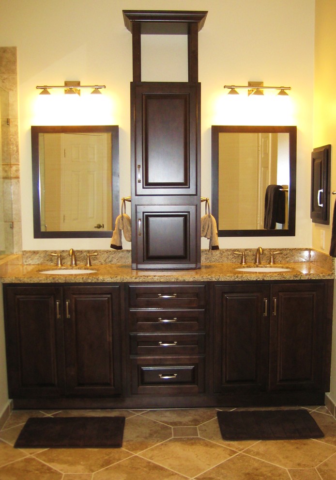 Mid-sized elegant master beige tile and mosaic tile porcelain tile corner shower photo in Houston with an undermount sink, raised-panel cabinets, dark wood cabinets, granite countertops, a two-piece toilet and beige walls