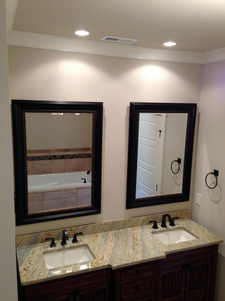 Example of a mid-sized arts and crafts master beige tile, brown tile and ceramic tile ceramic tile corner shower design in Other with dark wood cabinets, a hot tub, beige walls, an undermount sink and granite countertops