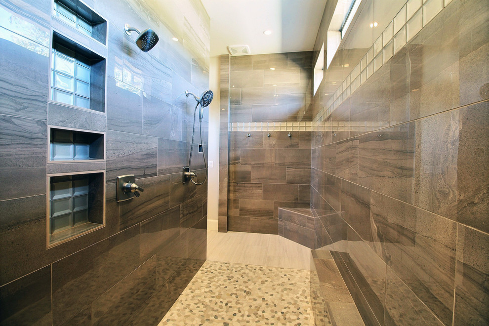 Example of a large transitional master gray tile and porcelain tile porcelain tile and gray floor bathroom design in Portland with recessed-panel cabinets, dark wood cabinets, a two-piece toilet, beige walls, an undermount sink and quartz countertops