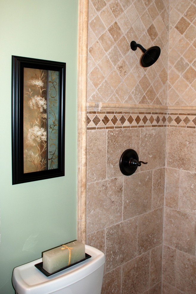 Small tuscan master beige tile and stone tile bathroom photo in San Francisco with a vessel sink, raised-panel cabinets, medium tone wood cabinets, quartz countertops and green walls