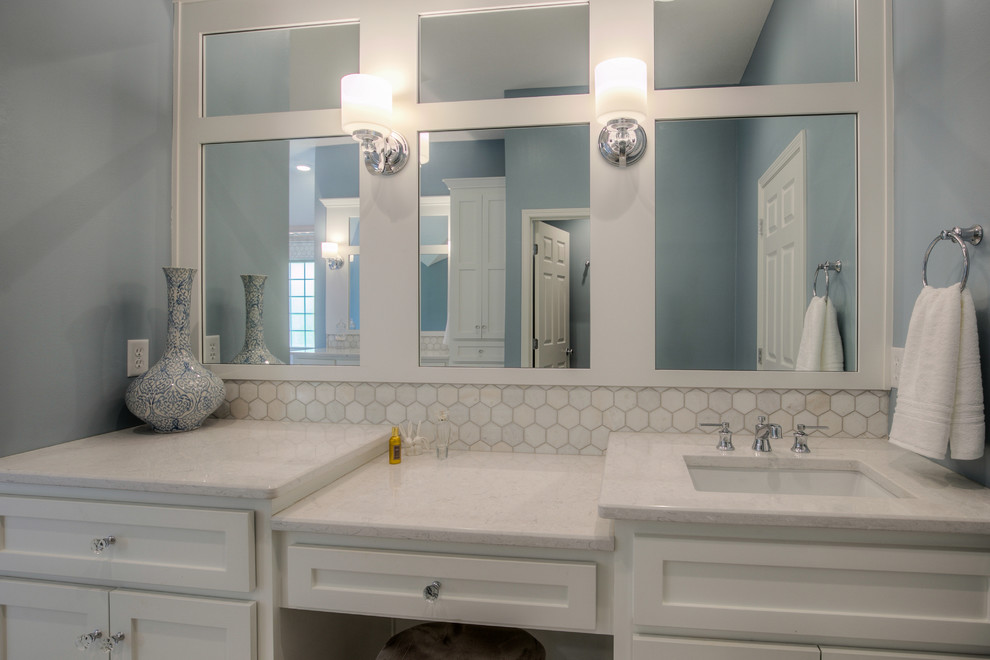 Bathroom - transitional blue tile and ceramic tile beige floor bathroom idea in Kansas City with white cabinets, a drop-in sink, quartz countertops, a hinged shower door and gray countertops