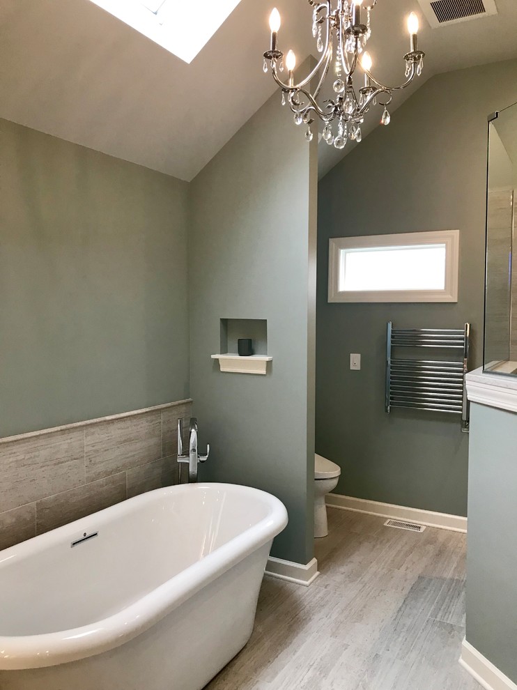 Bathroom - large transitional master gray tile and porcelain tile porcelain tile and gray floor bathroom idea in Chicago with flat-panel cabinets, white cabinets, a two-piece toilet, blue walls, an undermount sink, quartz countertops and white countertops