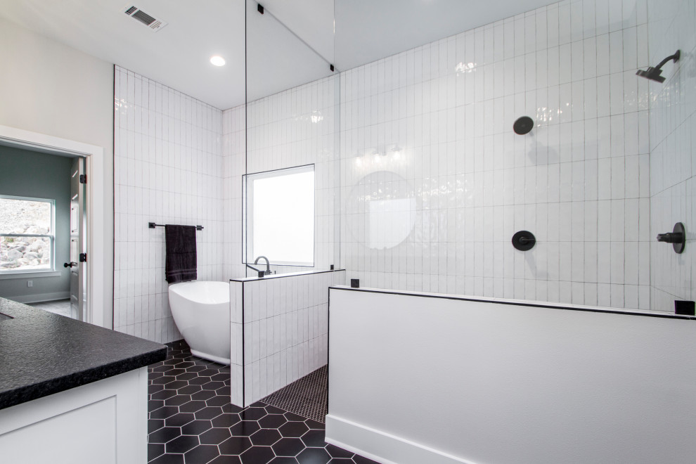 Example of a mid-sized transitional master white tile and ceramic tile ceramic tile and black floor bathroom design in Little Rock with recessed-panel cabinets, white cabinets, a two-piece toilet, gray walls, an undermount sink, soapstone countertops and black countertops