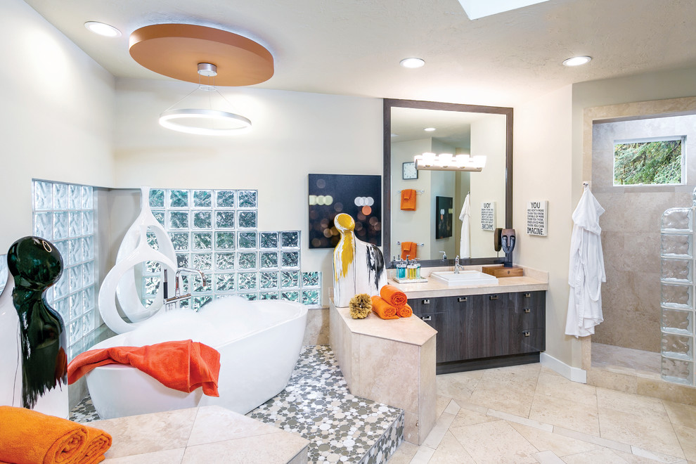 Contemporary ensuite bathroom in Miami with flat-panel cabinets, dark wood cabinets, a freestanding bath, an alcove shower, stone tiles, a built-in sink and tiled worktops.