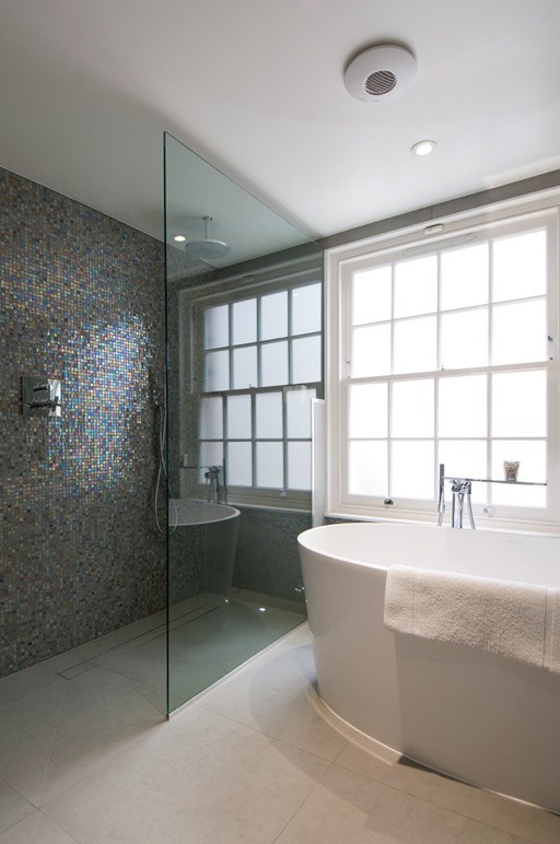 Example of a large trendy kids' gray tile and porcelain tile porcelain tile, gray floor and single-sink bathroom design in London with flat-panel cabinets, medium tone wood cabinets, a wall-mount toilet, gray walls, a vessel sink, glass countertops, brown countertops, a niche and a floating vanity