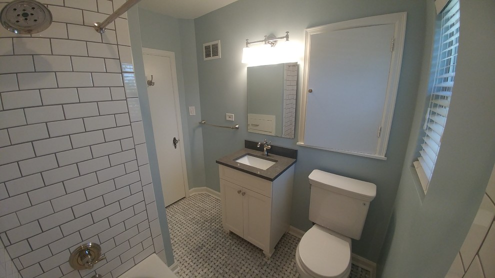 Design ideas for a small traditional ensuite bathroom in Other with shaker cabinets, white cabinets, a built-in bath, an alcove shower, a two-piece toilet, white tiles, ceramic tiles, blue walls, marble flooring, a submerged sink, engineered stone worktops, grey floors, a shower curtain and grey worktops.