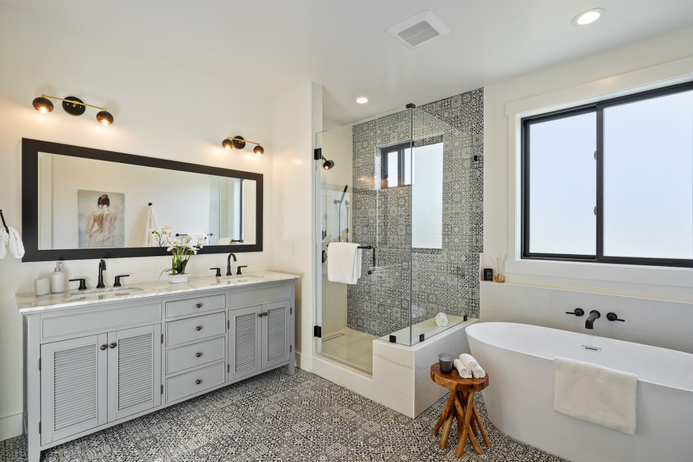 Transitional black and white tile multicolored floor and double-sink bathroom photo in San Francisco with recessed-panel cabinets, gray cabinets, white walls, an undermount sink, a hinged shower door, white countertops and a freestanding vanity