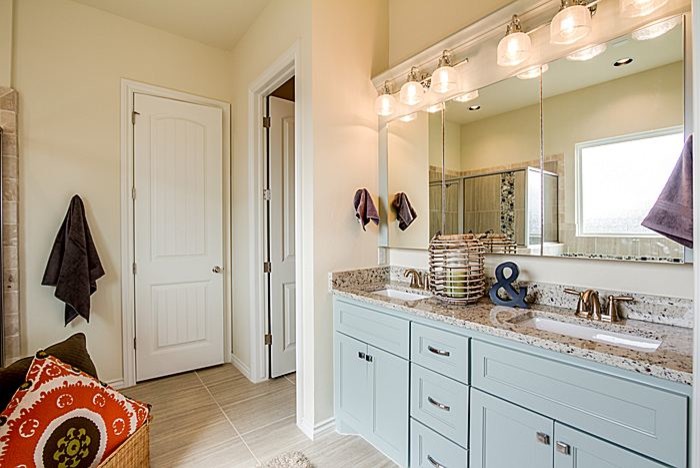 Large arts and crafts master beige tile bathroom photo in Oklahoma City with a drop-in sink, furniture-like cabinets, blue cabinets, quartzite countertops and beige walls