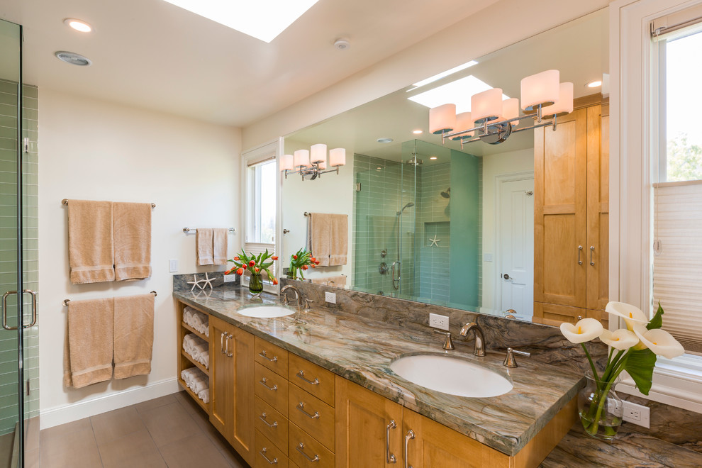 Large eclectic master brown tile and stone slab ceramic tile and brown floor corner shower photo in San Francisco with shaker cabinets, medium tone wood cabinets, a two-piece toilet, beige walls, an undermount sink, marble countertops and a hinged shower door