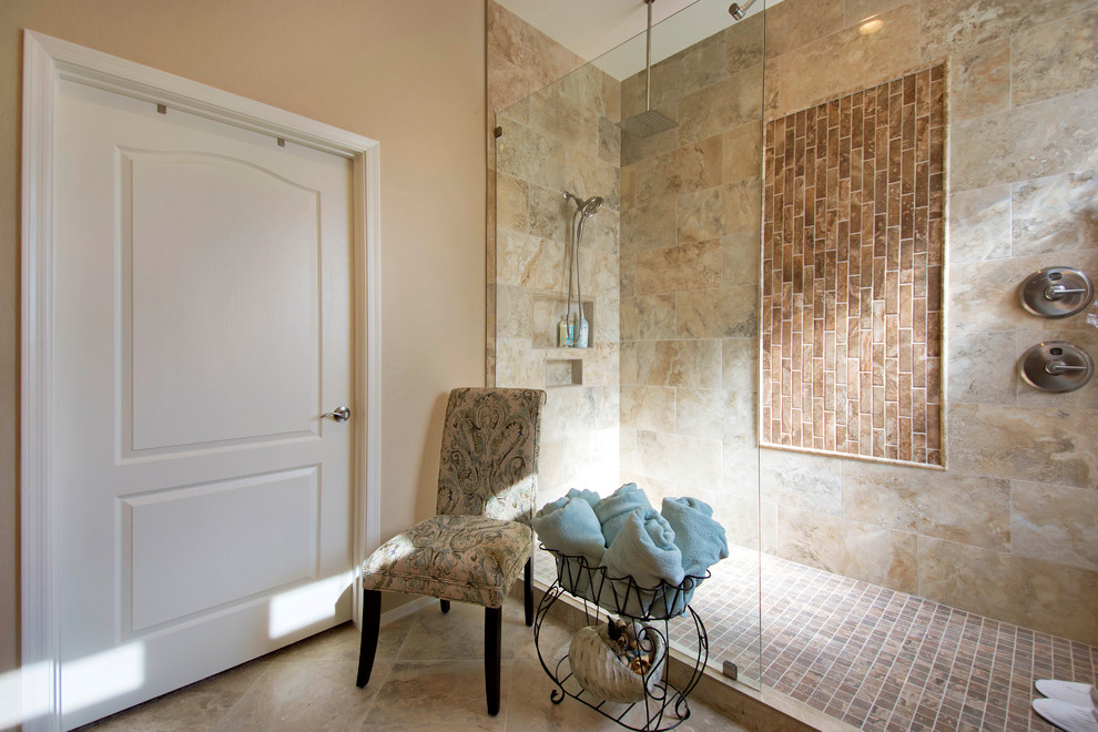 Photo of a large classic ensuite bathroom in Phoenix with recessed-panel cabinets, brown cabinets, a walk-in shower, beige tiles, porcelain tiles, beige walls, porcelain flooring, a submerged sink, granite worktops, a one-piece toilet, beige floors and an open shower.