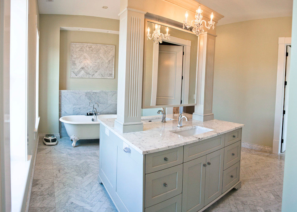 This is an example of a large farmhouse ensuite bathroom in Other with white cabinets, a claw-foot bath, ceramic tiles, flat-panel cabinets, a built-in shower, a two-piece toilet, beige walls, dark hardwood flooring, a submerged sink, granite worktops, white tiles and grey floors.