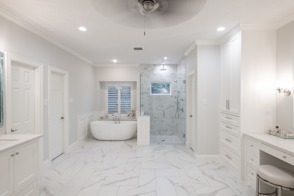 Example of a transitional 3/4 gray tile and white tile white floor bathroom design in Houston with shaker cabinets, white cabinets, gray walls, an undermount sink, a hinged shower door and white countertops