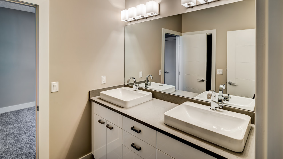 Medium sized traditional family bathroom in Edmonton with a console sink, flat-panel cabinets, white cabinets, engineered stone worktops and a two-piece toilet.