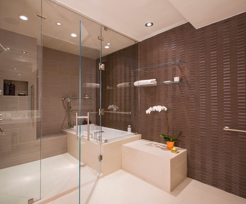 Inspiration for a large classic ensuite bathroom in DC Metro with a built-in bath, a built-in shower, brown walls, a submerged sink, flat-panel cabinets, light wood cabinets, engineered stone worktops, a one-piece toilet, brown tiles, porcelain tiles and porcelain flooring.