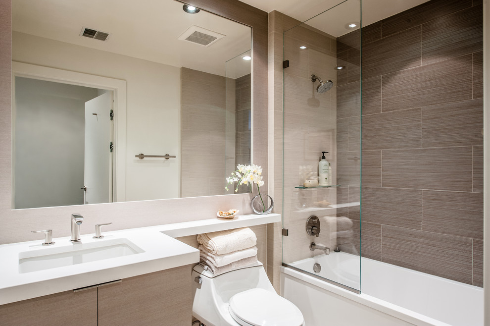 Design ideas for a medium sized contemporary ensuite bathroom in DC Metro with a pedestal sink, flat-panel cabinets, beige cabinets, quartz worktops, a one-piece toilet, beige tiles, ceramic tiles, white walls and ceramic flooring.