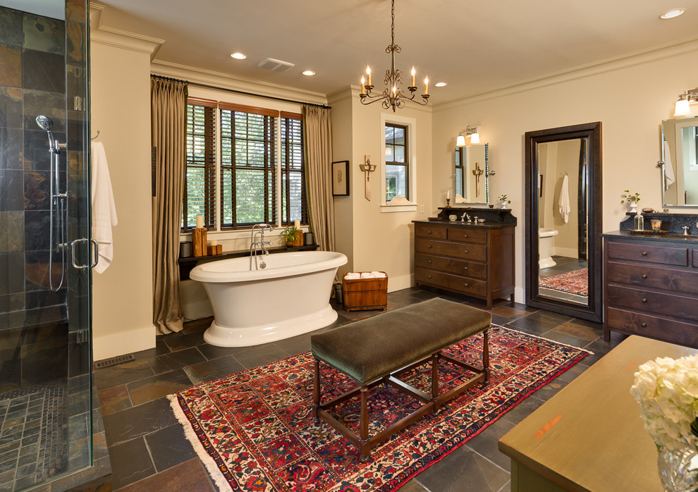 Bathroom - large rustic master multicolored tile and stone tile slate floor bathroom idea in Louisville with furniture-like cabinets, a two-piece toilet, beige walls, an undermount sink and granite countertops