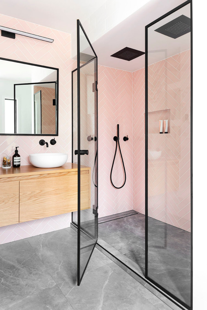 Inspiration for a contemporary master pink tile and ceramic tile gray floor and double-sink alcove shower remodel in Auckland with white walls, wood countertops, a hinged shower door, beige countertops, a floating vanity, flat-panel cabinets, light wood cabinets and a vessel sink