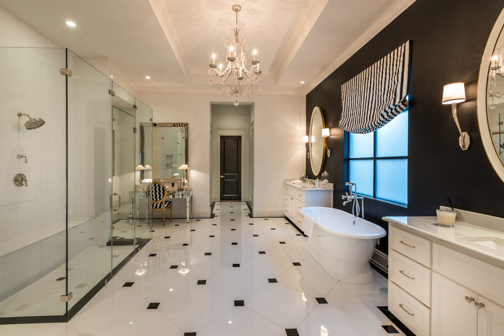 Bathroom - large transitional master black tile marble floor and white floor bathroom idea in Houston with shaker cabinets, white cabinets, a one-piece toilet, black walls, a drop-in sink, granite countertops and a hinged shower door