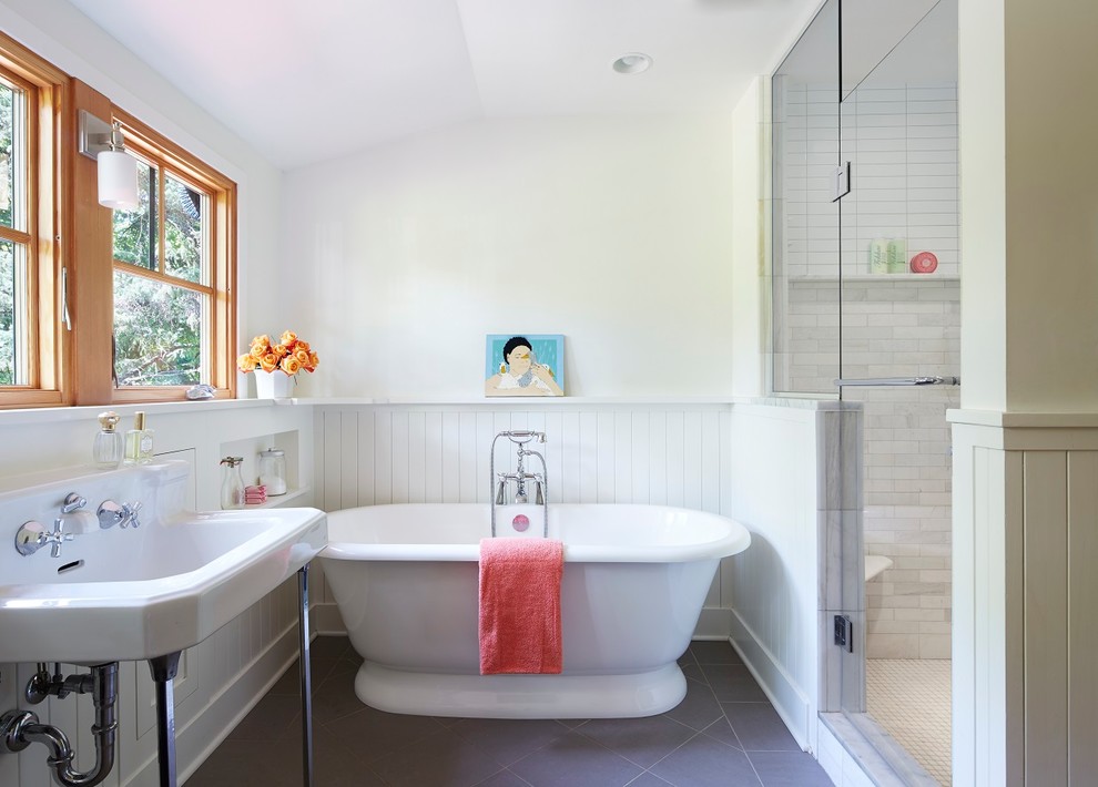 Design ideas for a medium sized traditional ensuite bathroom in Minneapolis with a console sink, white cabinets, a freestanding bath, an alcove shower, grey tiles, porcelain tiles, white walls and porcelain flooring.