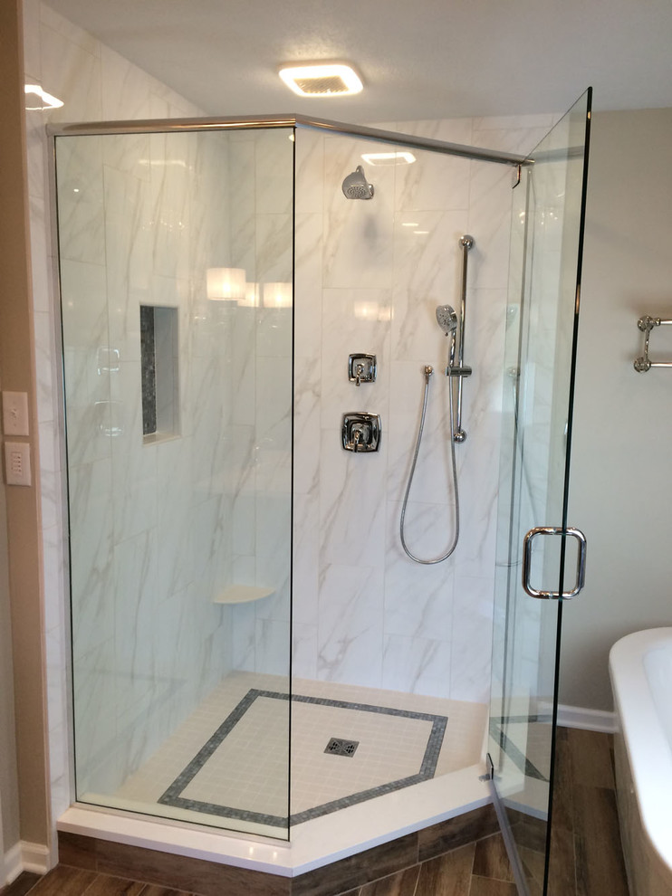 Bathroom - mid-sized transitional master gray tile and mosaic tile laminate floor and brown floor bathroom idea in Other with flat-panel cabinets, dark wood cabinets, beige walls, an undermount sink, quartzite countertops, a hinged shower door and white countertops