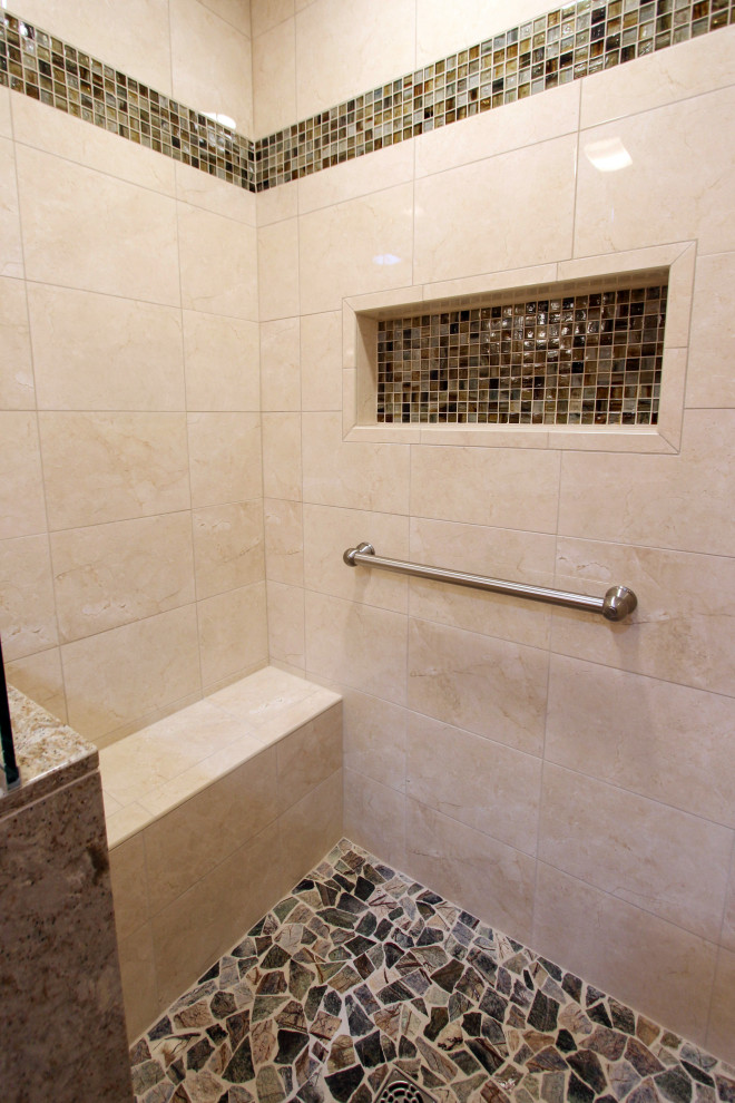 Inspiration for a medium sized classic ensuite bathroom in Cleveland with raised-panel cabinets, medium wood cabinets, an alcove shower, a two-piece toilet, beige tiles, ceramic tiles, orange walls, porcelain flooring, a submerged sink, engineered stone worktops, beige floors, a hinged door and beige worktops.