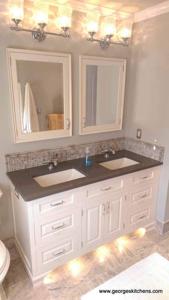 Example of a mid-sized classic kids' multicolored tile and stone tile travertine floor bathroom design in Philadelphia with an undermount sink, raised-panel cabinets, beige cabinets, quartz countertops, a two-piece toilet and gray walls