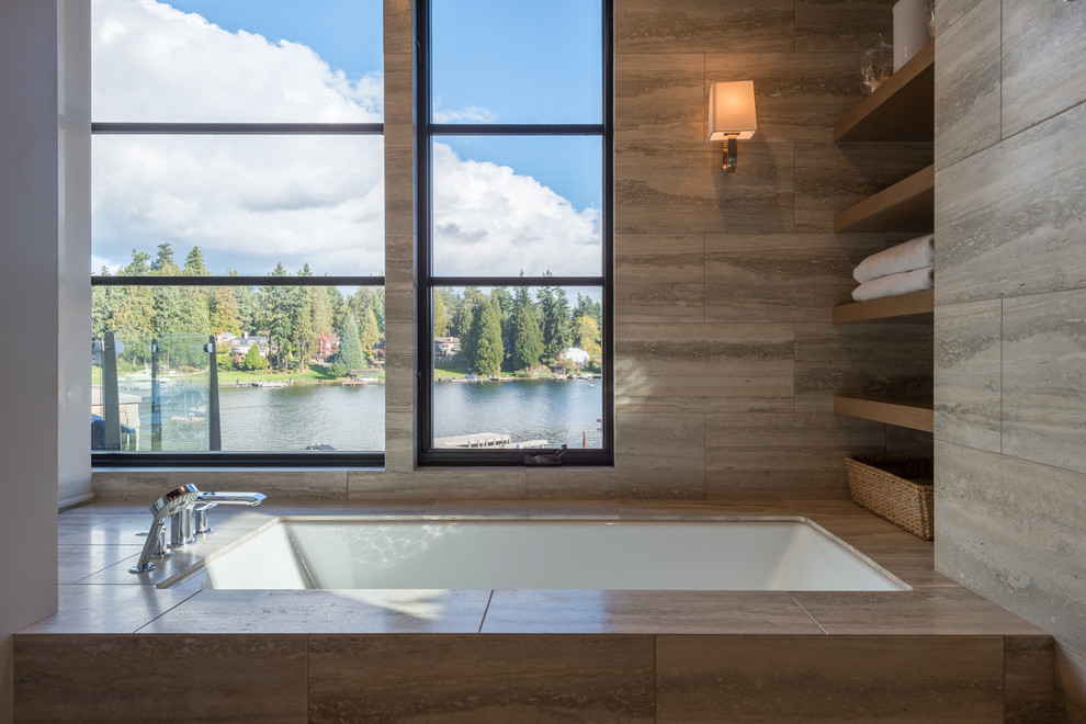 Inspiration for a large contemporary ensuite bathroom in Seattle with a submerged bath, brown walls, porcelain flooring and beige floors.
