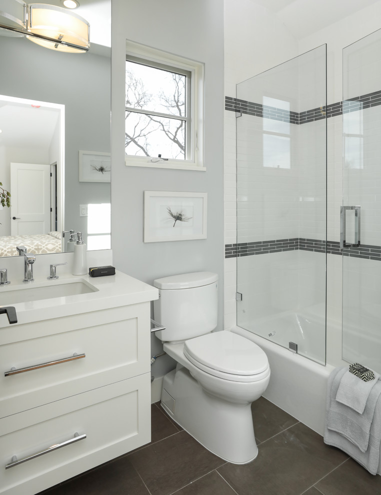 Mid-sized tuscan kids' white tile and ceramic tile ceramic tile and brown floor bathroom photo in San Francisco with shaker cabinets, white cabinets, a two-piece toilet, gray walls, an undermount sink, quartz countertops and a hinged shower door