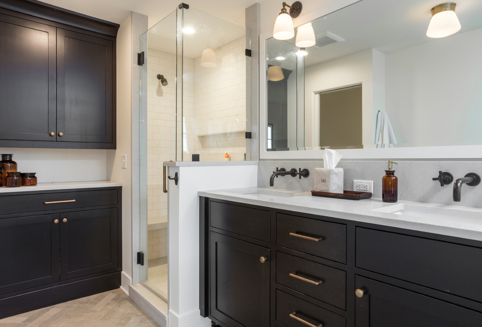 This is an example of a large mediterranean ensuite bathroom in Portland with recessed-panel cabinets, a freestanding bath, a corner shower, a one-piece toilet, white walls, limestone flooring, a submerged sink, engineered stone worktops, grey floors, a hinged door and dark wood cabinets.