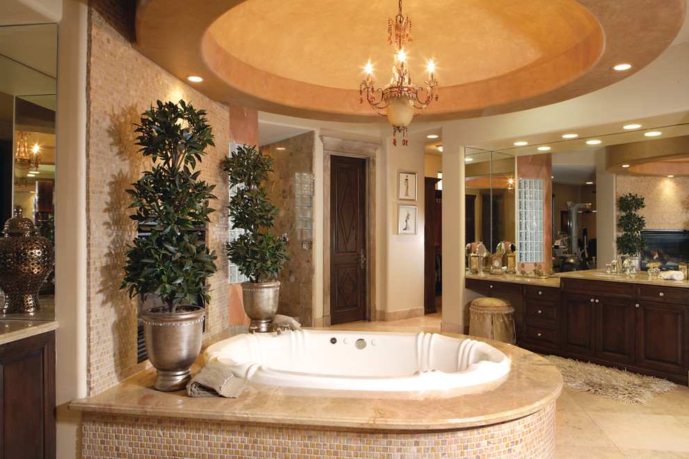 Design ideas for a mediterranean bathroom in Phoenix with dark wood cabinets, a built-in bath and a corner shower.