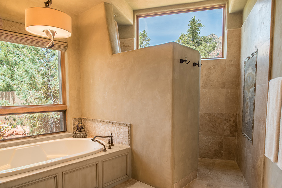 Réalisation d'une grande salle de bain principale sud-ouest américain en bois vieilli avec une baignoire encastrée, une douche à l'italienne, un mur beige, un lavabo encastré, un placard avec porte à panneau encastré et un carrelage beige.