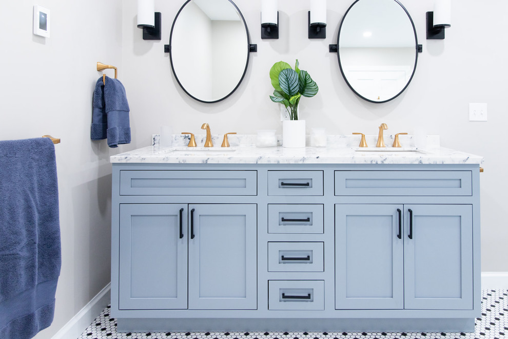 Inspiration for a medium sized modern ensuite bathroom in Boston with blue cabinets, a freestanding bath, a walk-in shower, white tiles, ceramic tiles, beige walls, ceramic flooring, black floors, a sliding door, white worktops, a wall niche, double sinks and a built in vanity unit.
