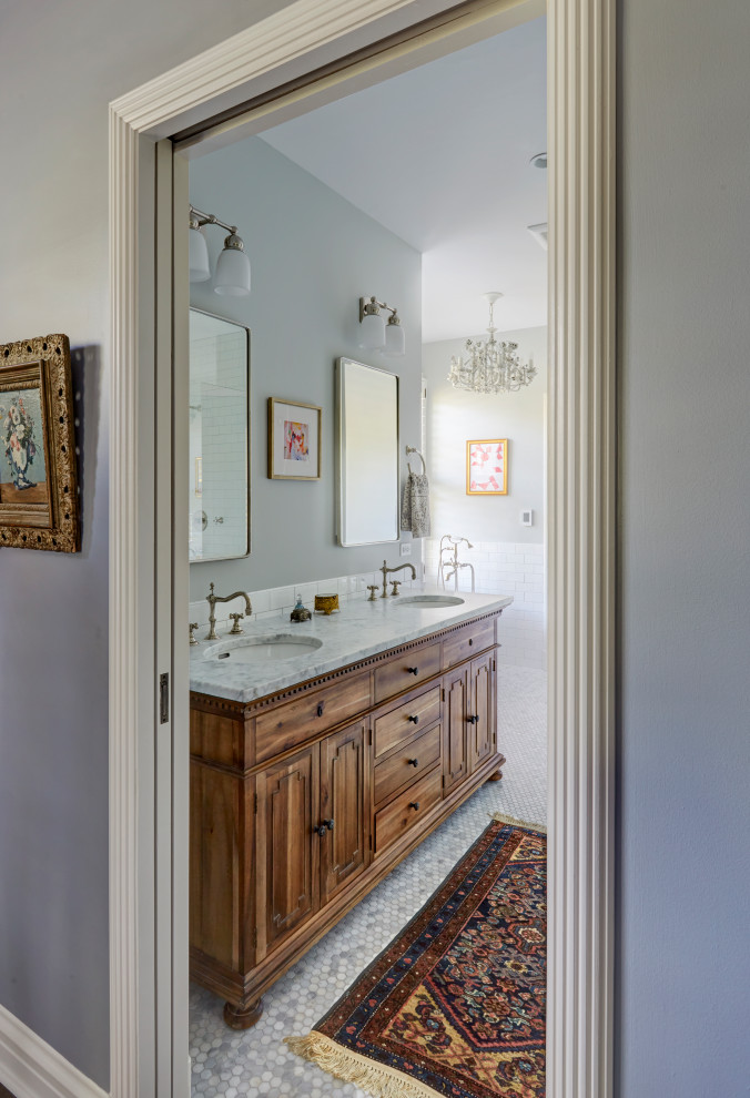 Photo of a traditional bathroom in Chicago with recessed-panel cabinets, medium wood cabinets, white tiles, metro tiles, grey walls, mosaic tile flooring, a submerged sink, white floors, white worktops, double sinks and a freestanding vanity unit.