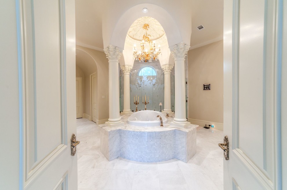 Example of a huge classic master white tile and stone tile marble floor bathroom design in Houston with an undermount sink and white walls