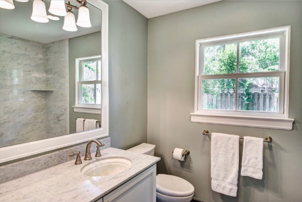 Example of a mid-sized transitional kids' white tile and ceramic tile porcelain tile and gray floor bathroom design in Houston with recessed-panel cabinets, white cabinets, a two-piece toilet, blue walls, an undermount sink and quartz countertops