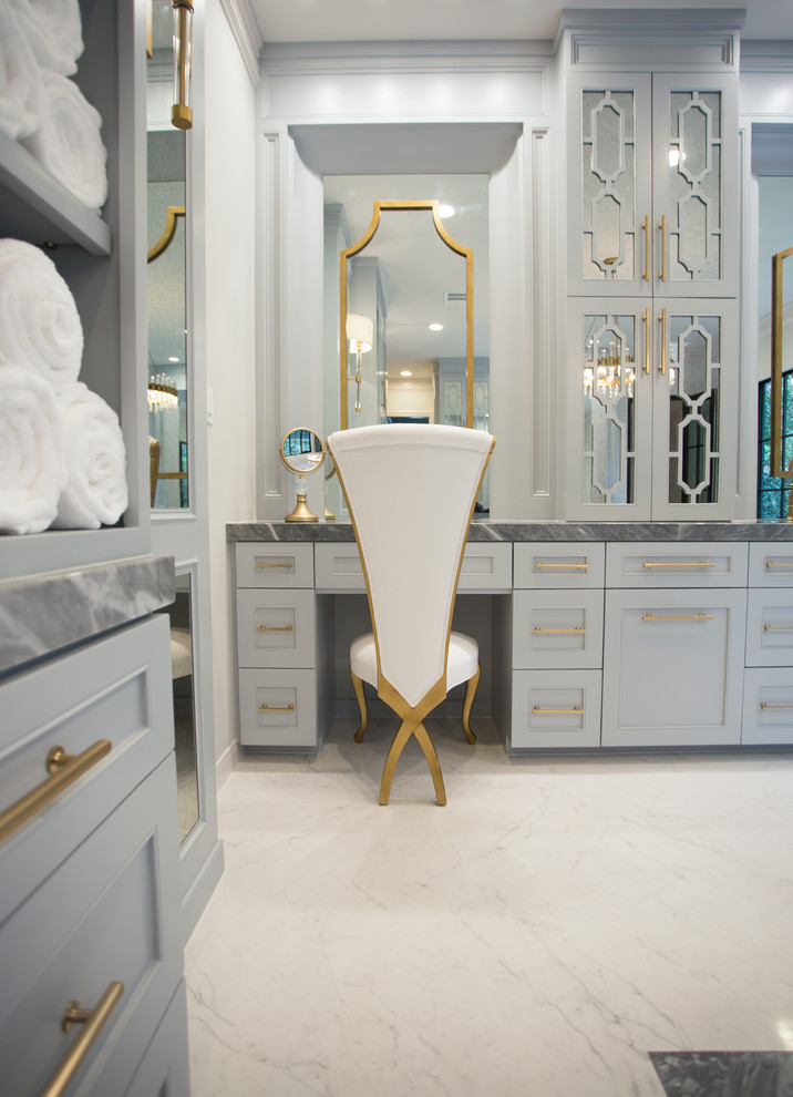 Inspiration for a huge transitional master white tile and porcelain tile porcelain tile and white floor bathroom remodel with furniture-like cabinets, gray cabinets, a wall-mount toilet, white walls, a drop-in sink, marble countertops and a hinged shower door