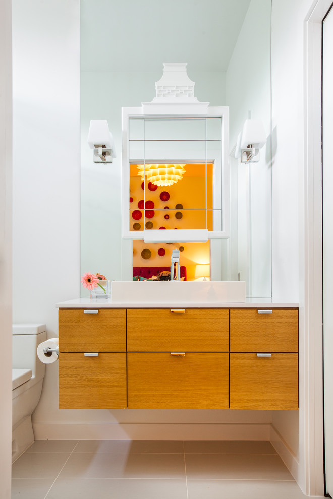 Example of a trendy bathroom design in Houston with flat-panel cabinets, medium tone wood cabinets and white walls