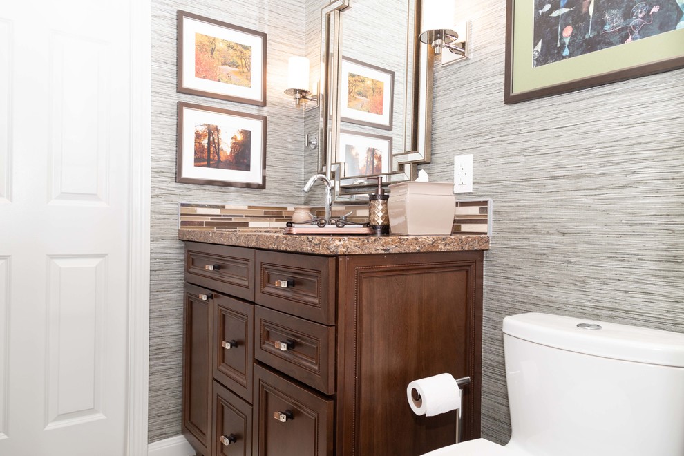 Inspiration for a medium sized contemporary family bathroom in Houston with freestanding cabinets, brown cabinets, an alcove shower, a two-piece toilet, beige tiles, porcelain tiles, grey walls, porcelain flooring, a submerged sink, engineered stone worktops, beige floors, a hinged door and brown worktops.