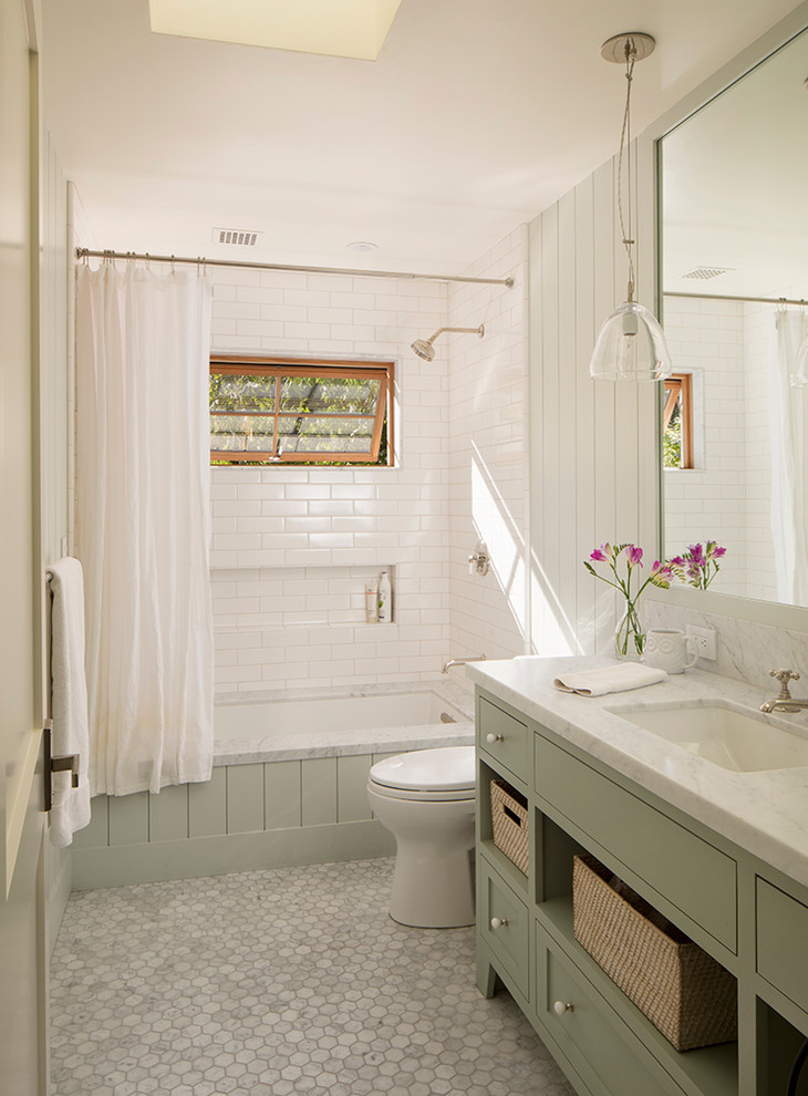 This is an example of a medium sized rural bathroom in San Francisco with grey cabinets, a shower/bath combination, grey tiles, metro tiles, grey walls, mosaic tile flooring, an integrated sink, marble worktops and shaker cabinets.