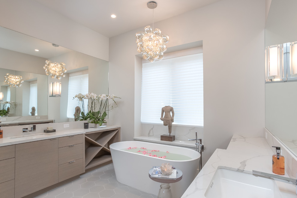 This is an example of a large contemporary ensuite bathroom in San Francisco with flat-panel cabinets, beige cabinets, a walk-in shower, a one-piece toilet, beige walls, ceramic flooring, marble worktops and grey floors.