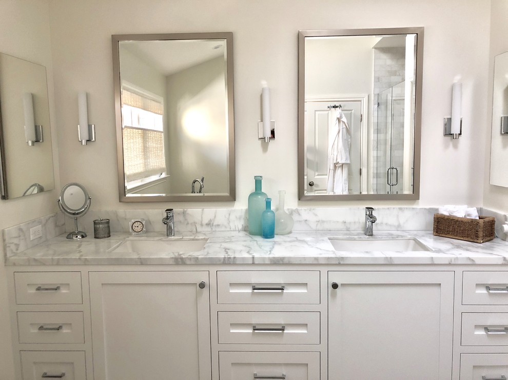 Mid-sized transitional master bathroom photo in San Francisco with shaker cabinets, white cabinets, white walls, an undermount sink, marble countertops and white countertops