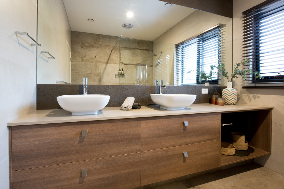 Mid-sized trendy multicolored tile and porcelain tile porcelain tile bathroom photo in Melbourne with flat-panel cabinets, medium tone wood cabinets, multicolored walls, a vessel sink and quartz countertops