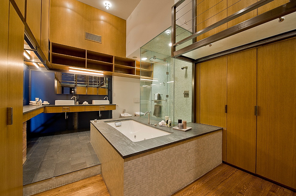 Modern bathroom in New York with a vessel sink.