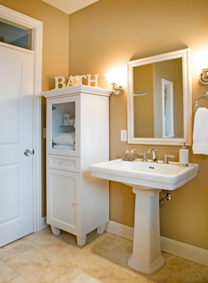 This is an example of a small traditional shower room bathroom in Vancouver with beige walls, travertine flooring, a pedestal sink, shaker cabinets and white cabinets.