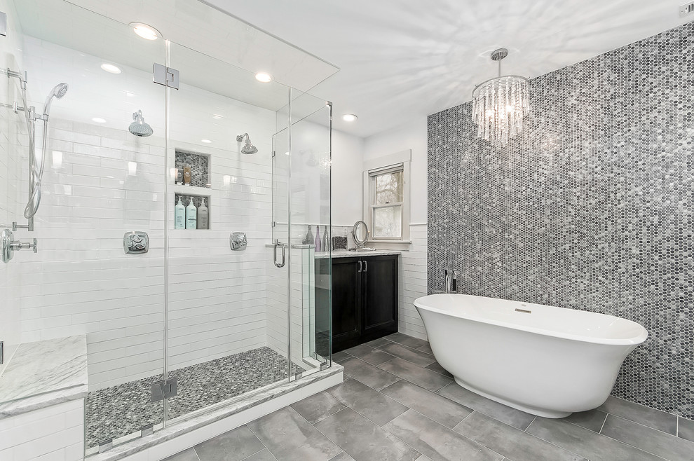 Bathroom - transitional master black and white tile, gray tile and mosaic tile gray floor and porcelain tile bathroom idea in Columbus with recessed-panel cabinets, black cabinets, white walls, a hinged shower door and a niche
