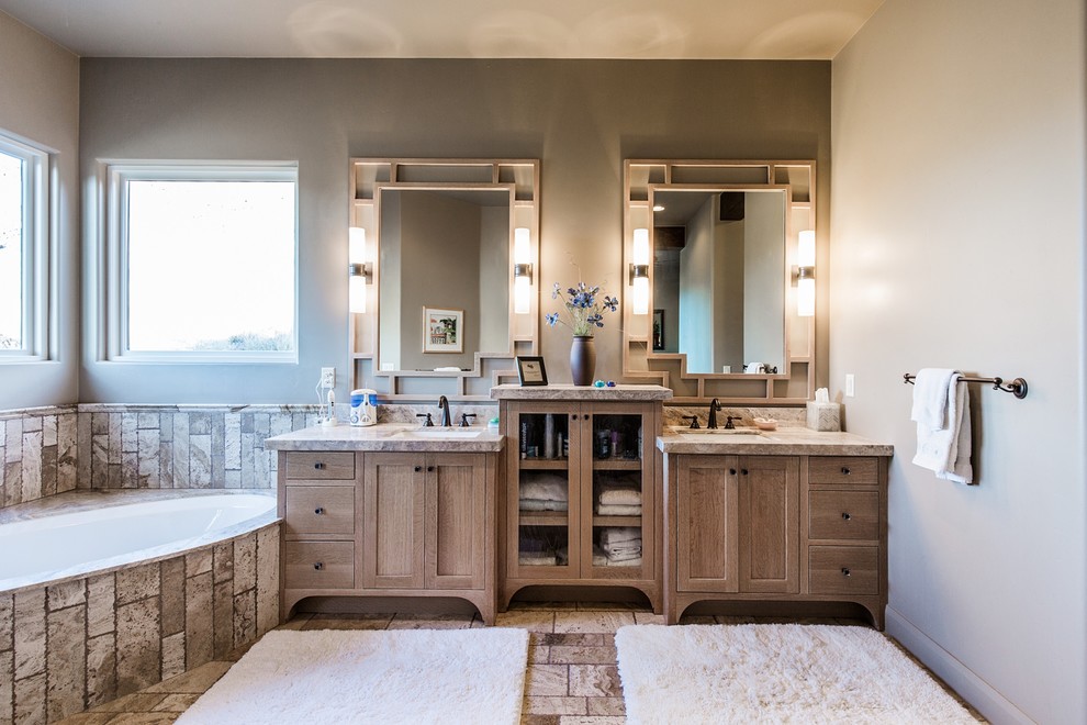 Bathroom - large mediterranean master ceramic tile and beige floor bathroom idea in Salt Lake City with recessed-panel cabinets, light wood cabinets, a two-piece toilet, beige walls, an undermount sink, granite countertops and a hinged shower door